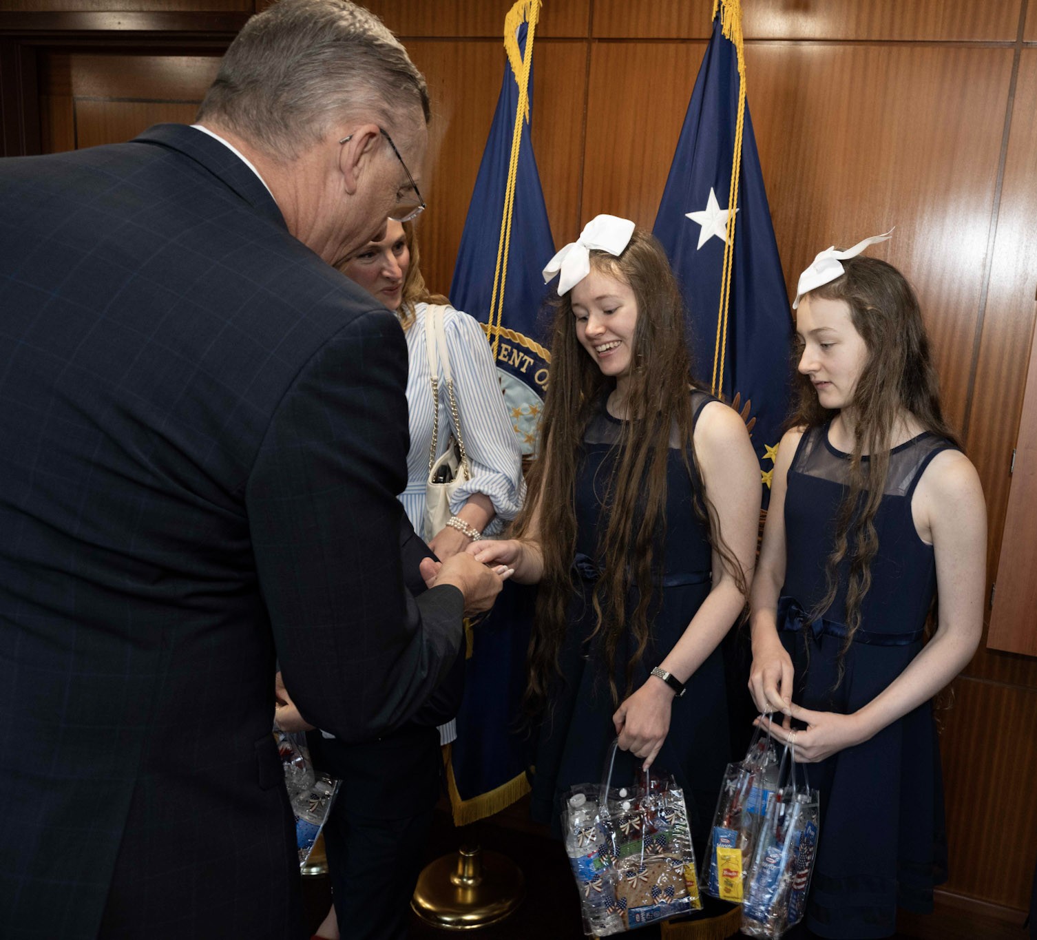 Elizabeth presenting a care package to the Secretary of Veterans Affairs